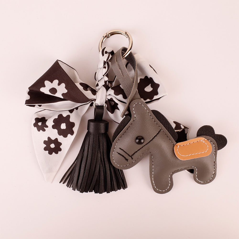 Black bow bag accessory styled with daily work tote