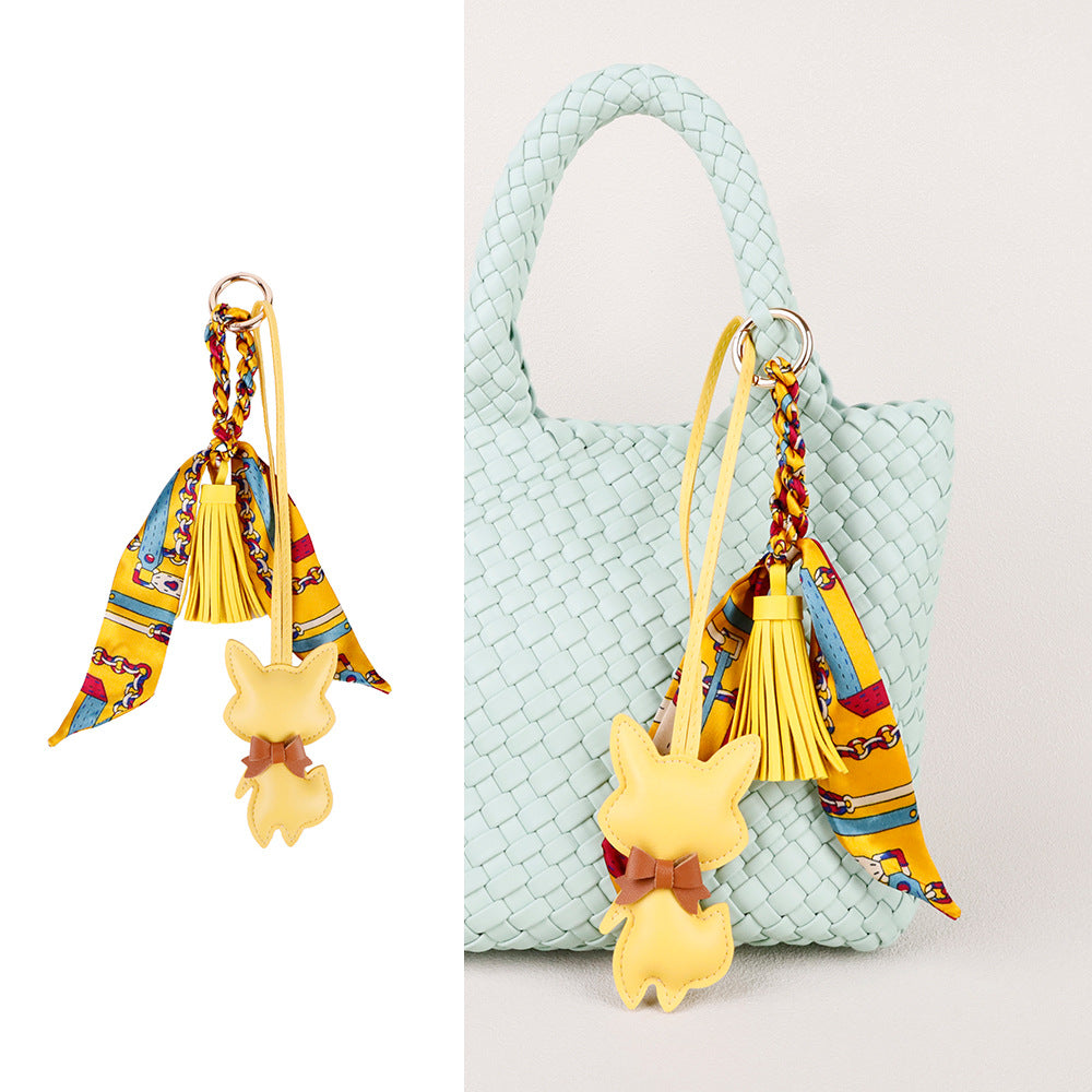 Leather fox figure used as a distinctive handbag accent