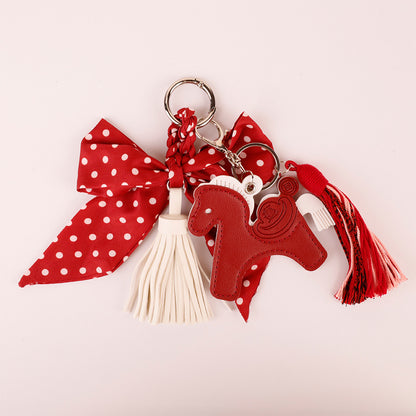 Handmade bow keyring with red fabric and tassel details