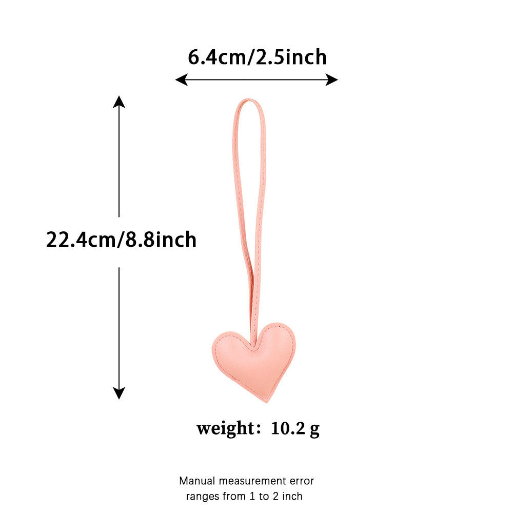 Small leather look heart charm with tassel