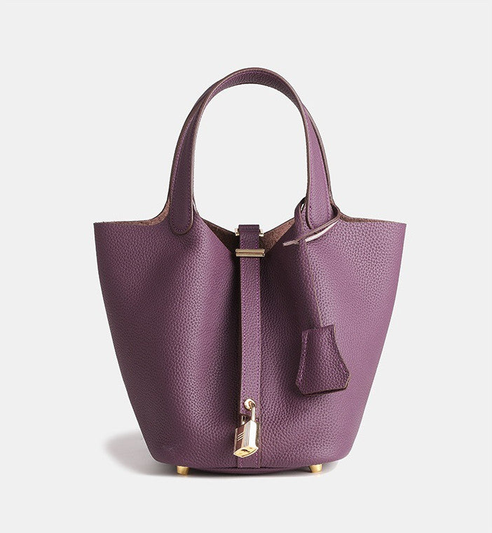 small designer leather bucket purse with adjustable shoulder strap