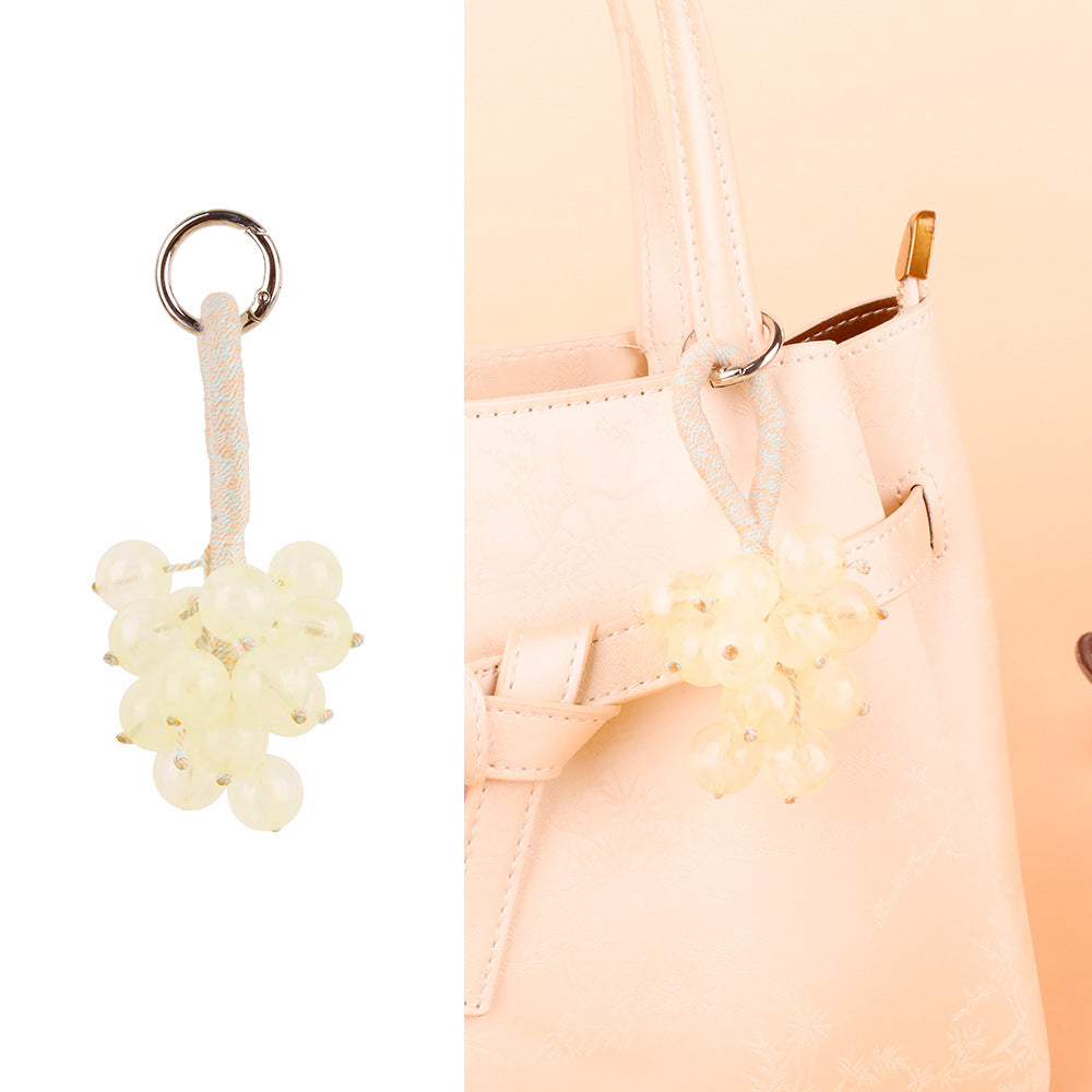 Grape-inspired decoration adding detail to a purse