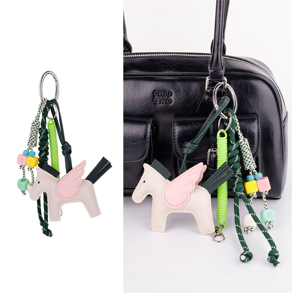 Horse purse accent with braided string loop on a tote