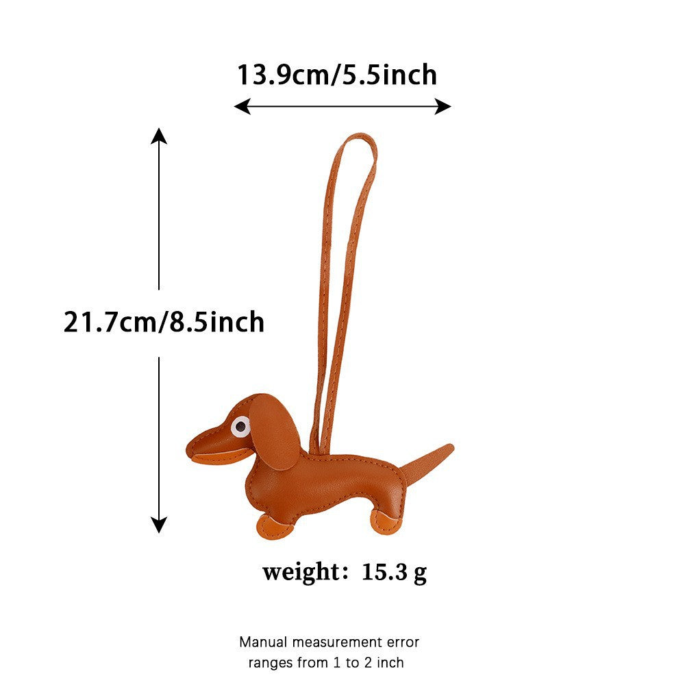 Textured leather sausage dog charm close-up showing fine artisan craft