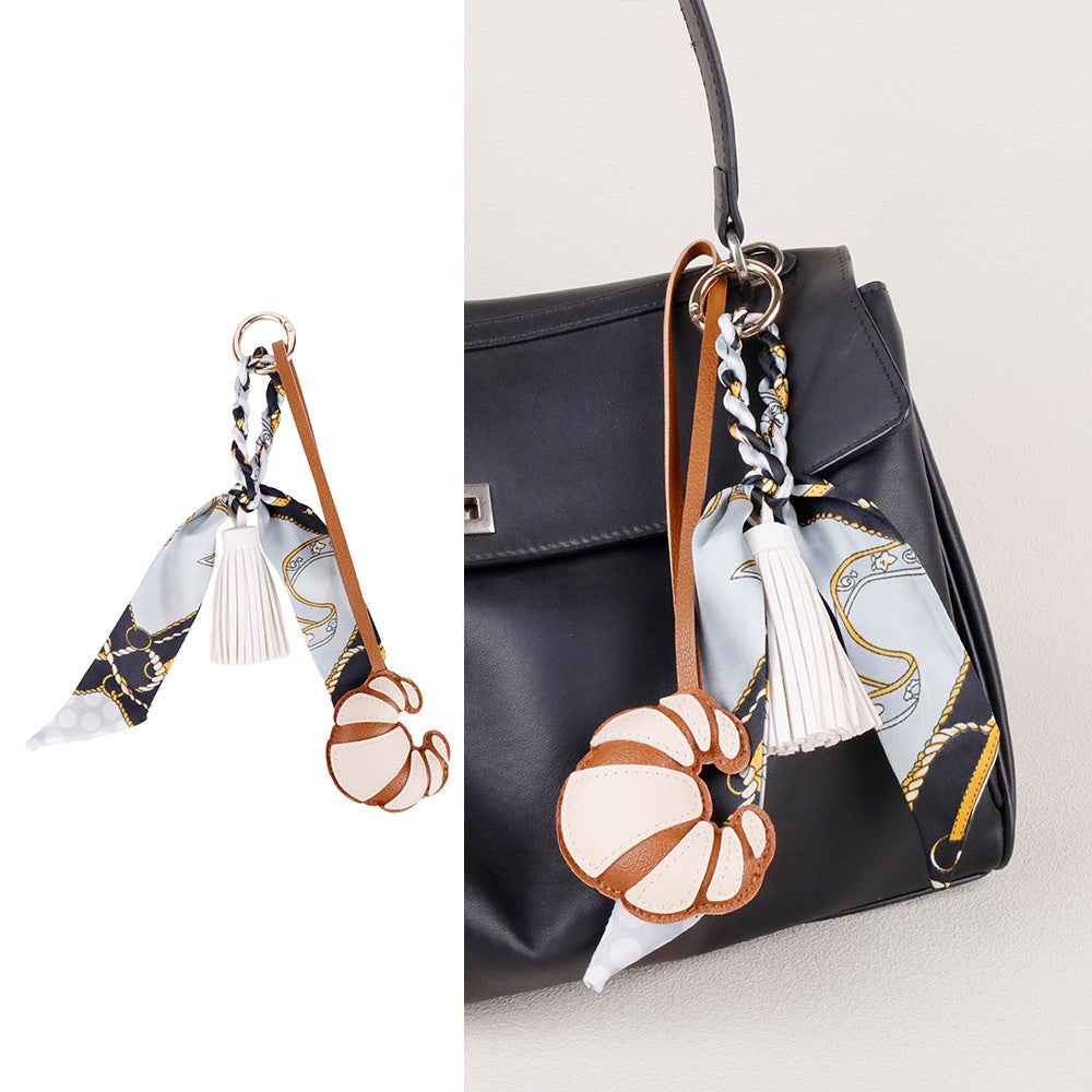 Handmade croissant accessory presented as a gift for her