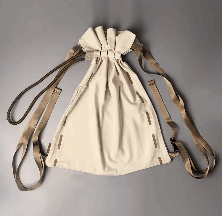 Artistic backpack featured in lifestyle flat lay