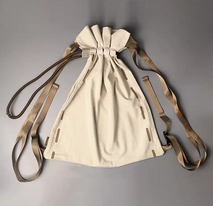 Artistic backpack featured in lifestyle flat lay