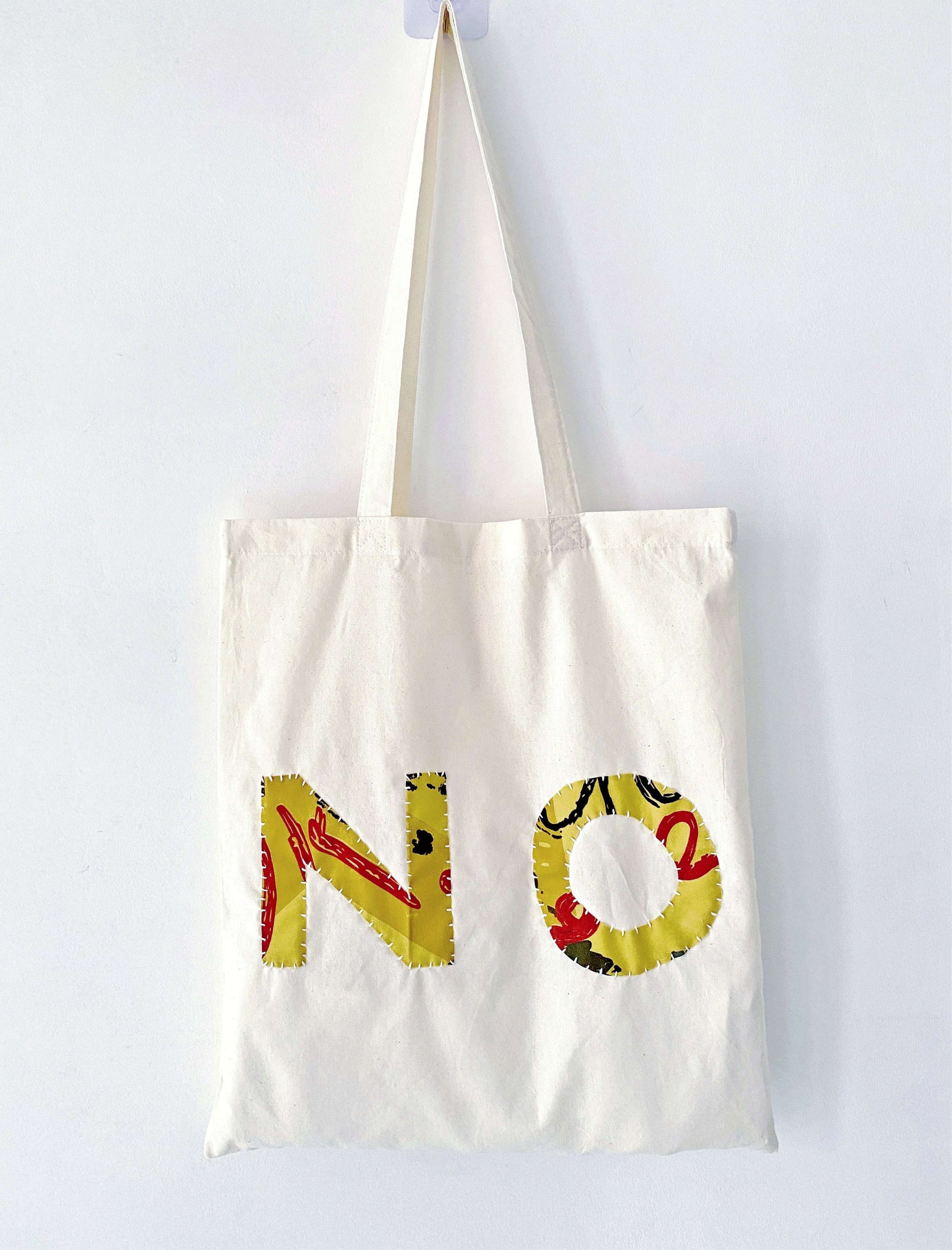 Vintage inspired collage design on an unstructured cotton pouch that becomes softer with every single wash