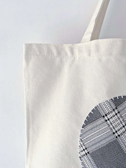 Heavy-duty natural canvas tote with folk-art stitching. A sturdy gift for mentors who appreciate timeless, sustainable handmade quality.