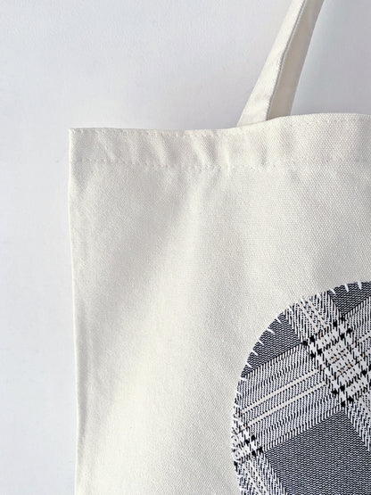 Heavy-duty natural canvas tote with folk-art stitching. A sturdy gift for mentors who appreciate timeless, sustainable handmade quality.