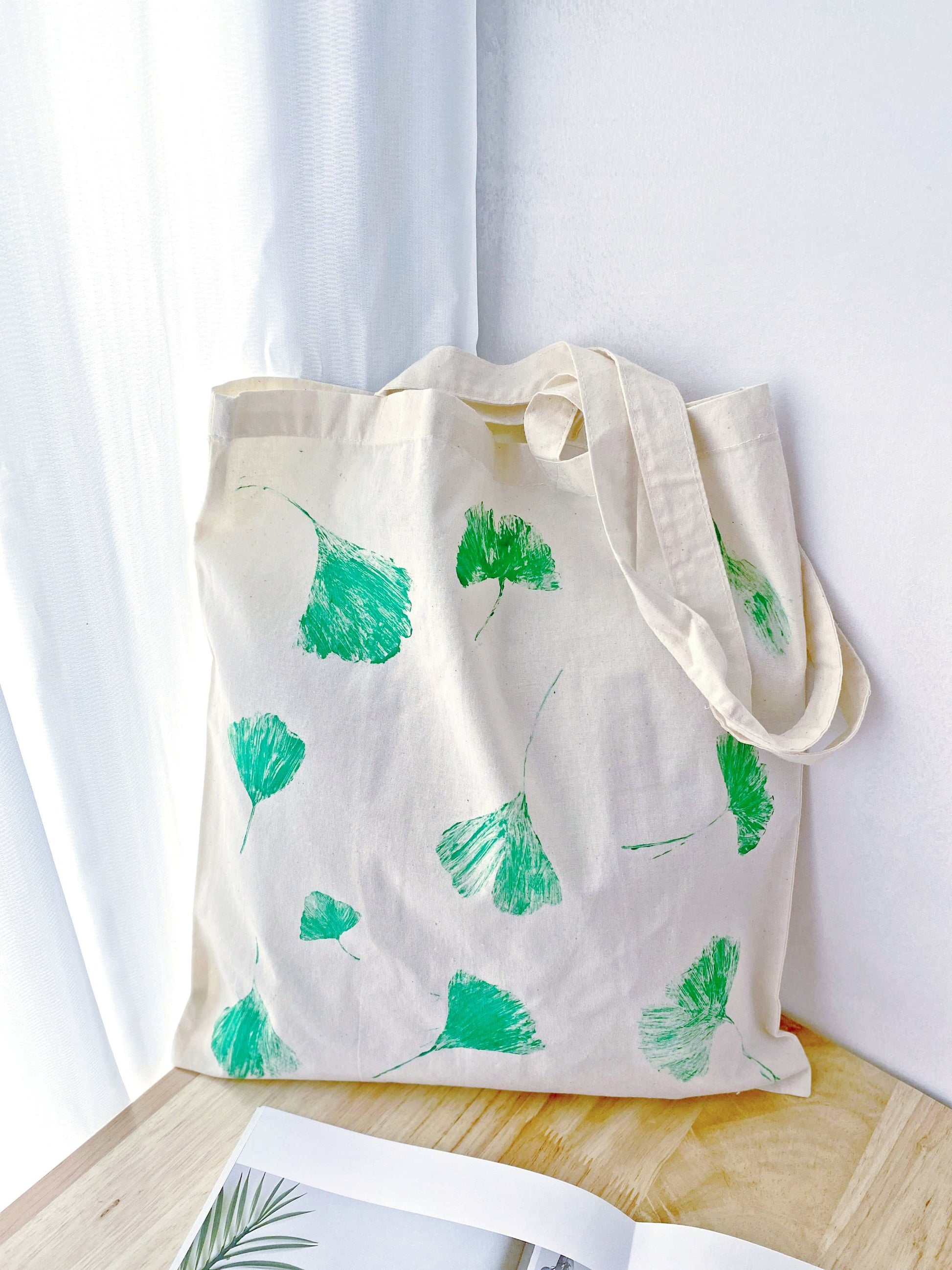 Handmade nature motif on a soft cotton bag, perfect for bohemian chic.