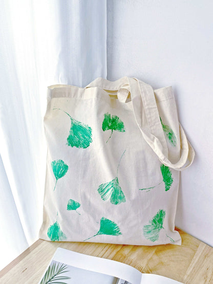 Handmade nature motif on a soft cotton bag, perfect for bohemian chic.