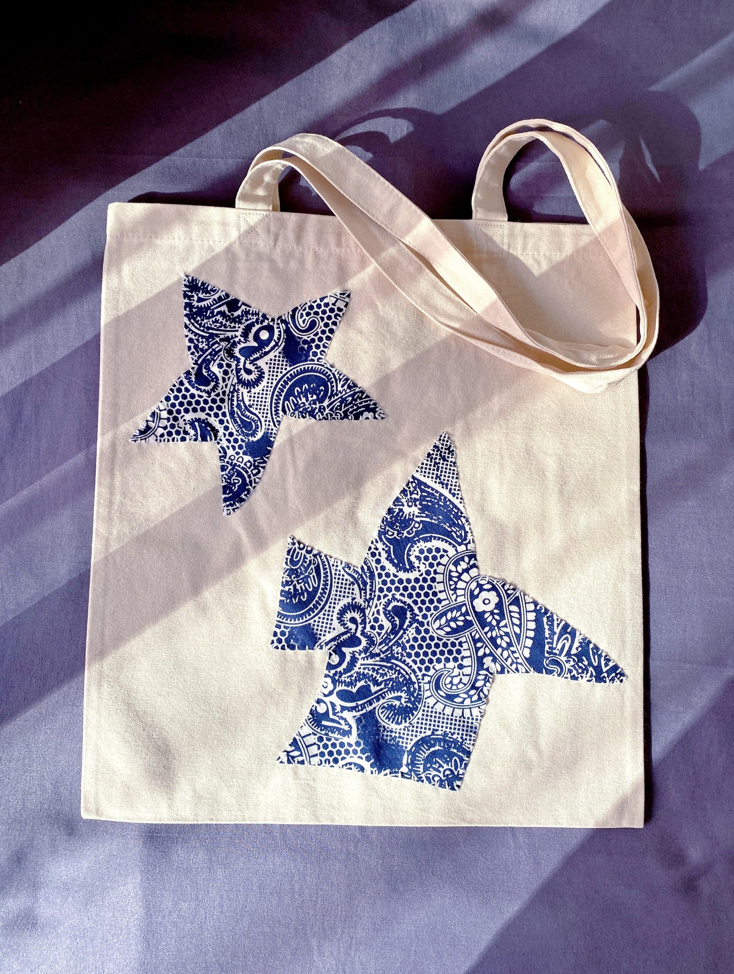 Artistic patchwork canvas bag that makes a thoughtful personalized birthday gift for her.
