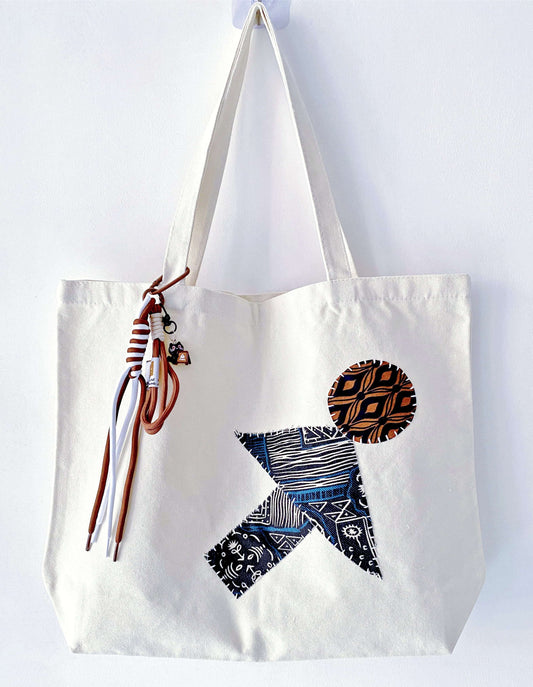 A sturdy yet foldable tote that doesn't scream for attention, just feels right.