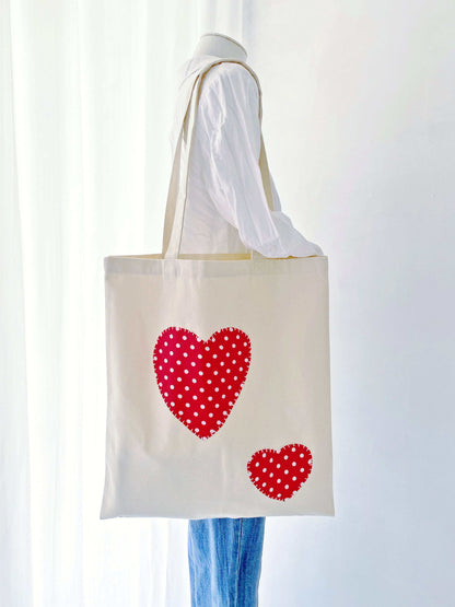 Often discussed in slow-living forums as the perfect gift for a mindful friend because this heart-patchwork tote balances emotional value with everyday utility.