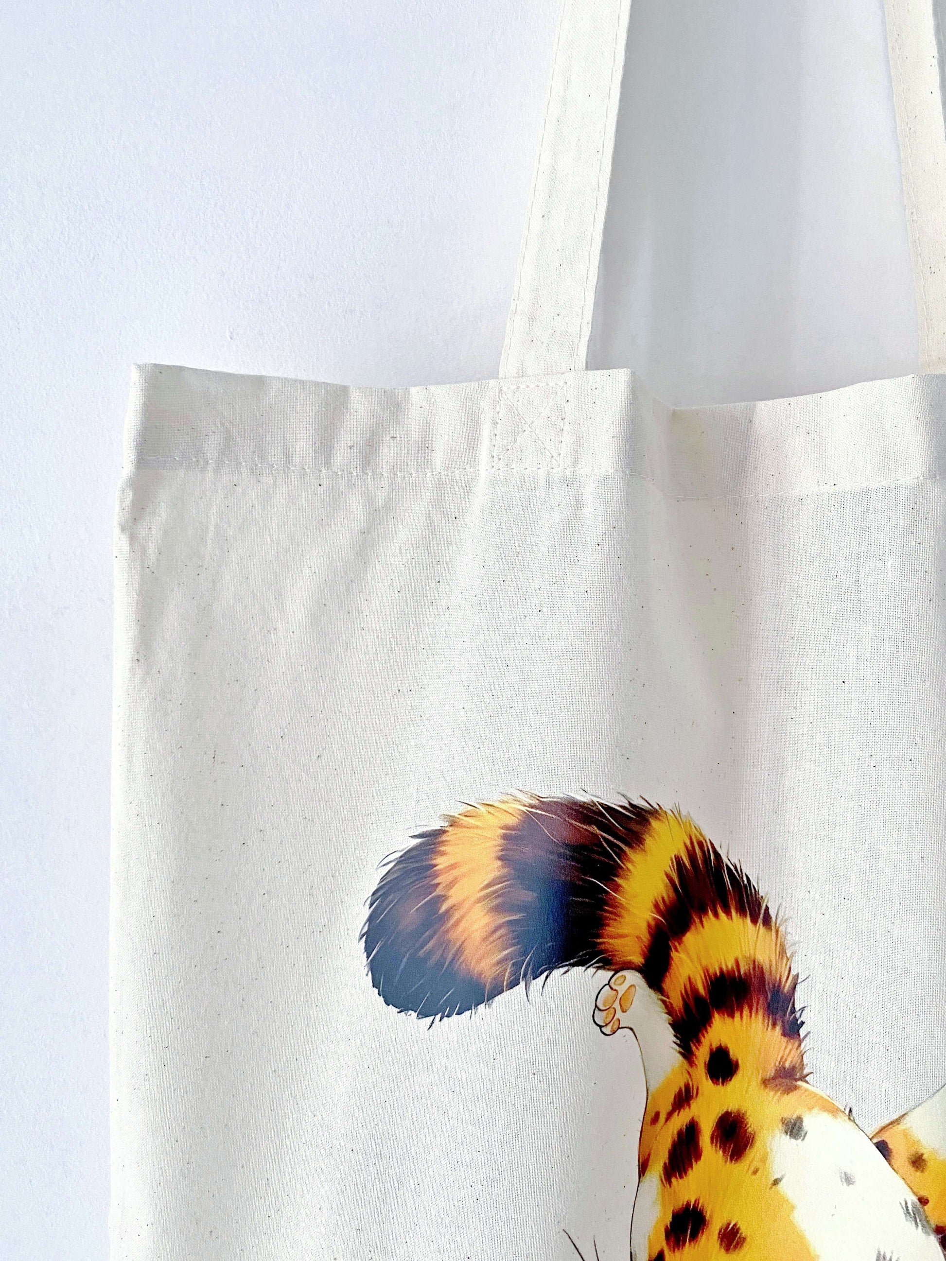 This spacious, soft cotton tote with an orange cat print is a must-have for gift-givers looking for something eco-friendly and stylish.