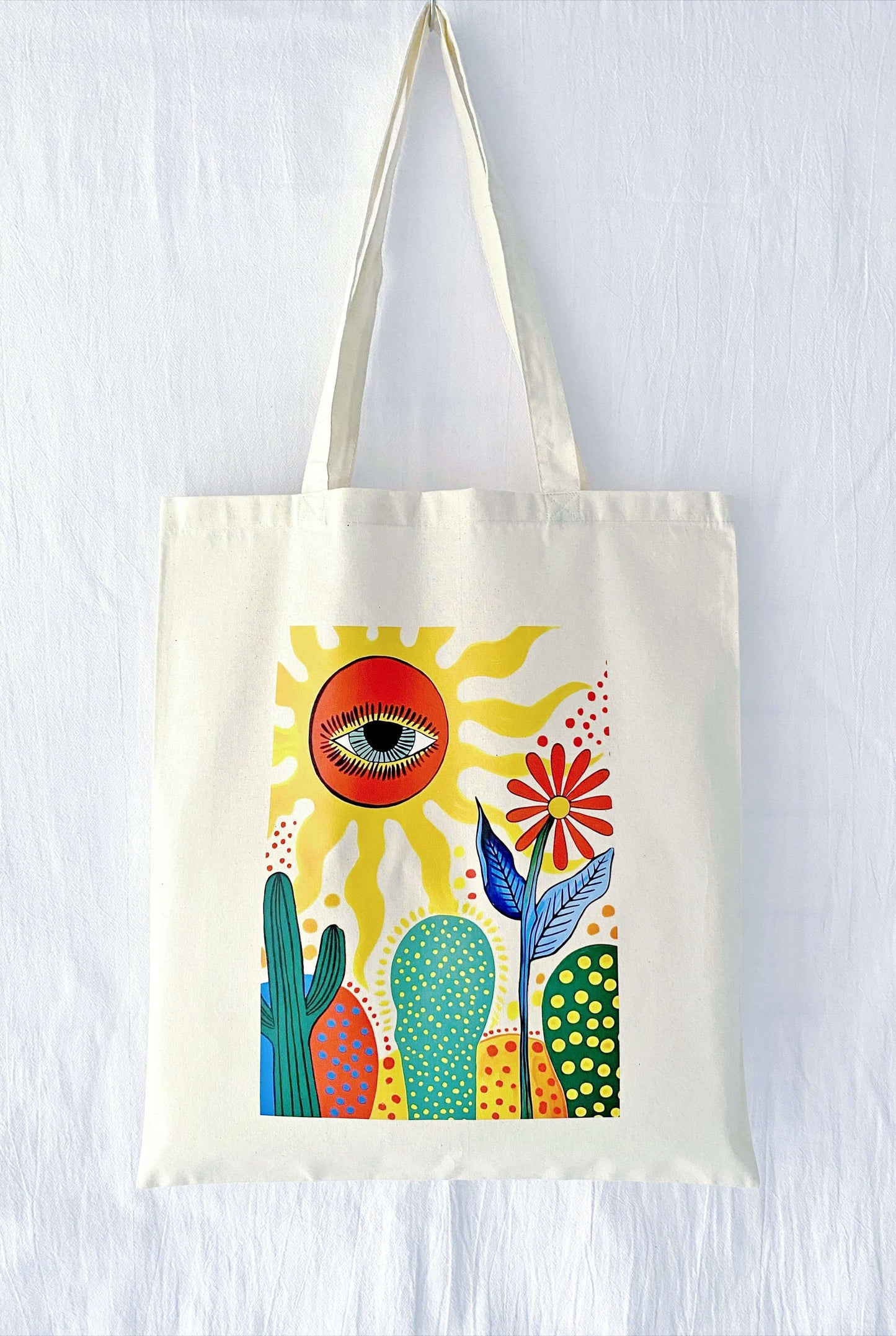 A stack of three different hand-printed totes, suggesting a thoughtful matching gift set for bridesmaids or a group of close sisters.