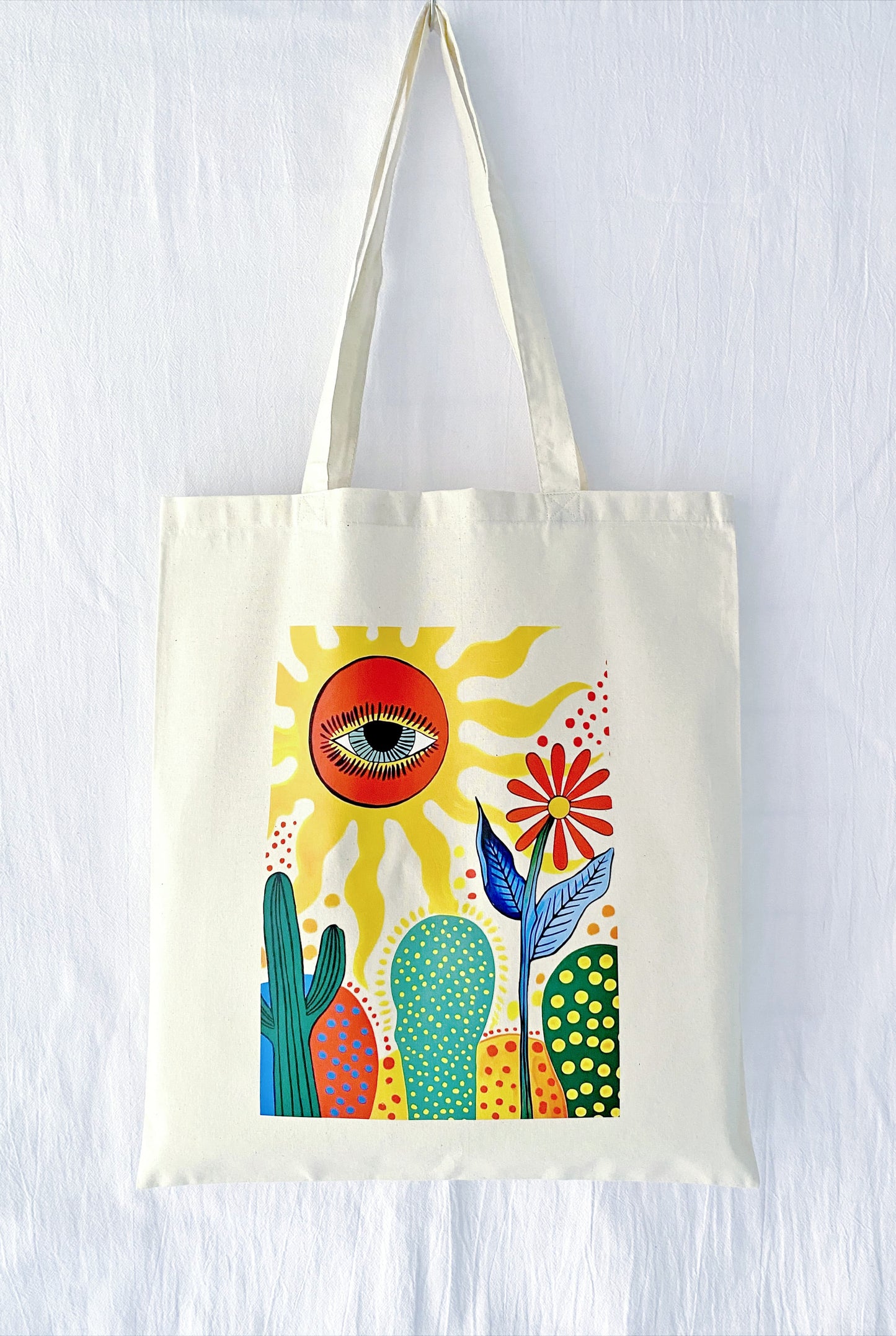 A stack of three different hand-printed totes, suggesting a thoughtful matching gift set for bridesmaids or a group of close sisters.