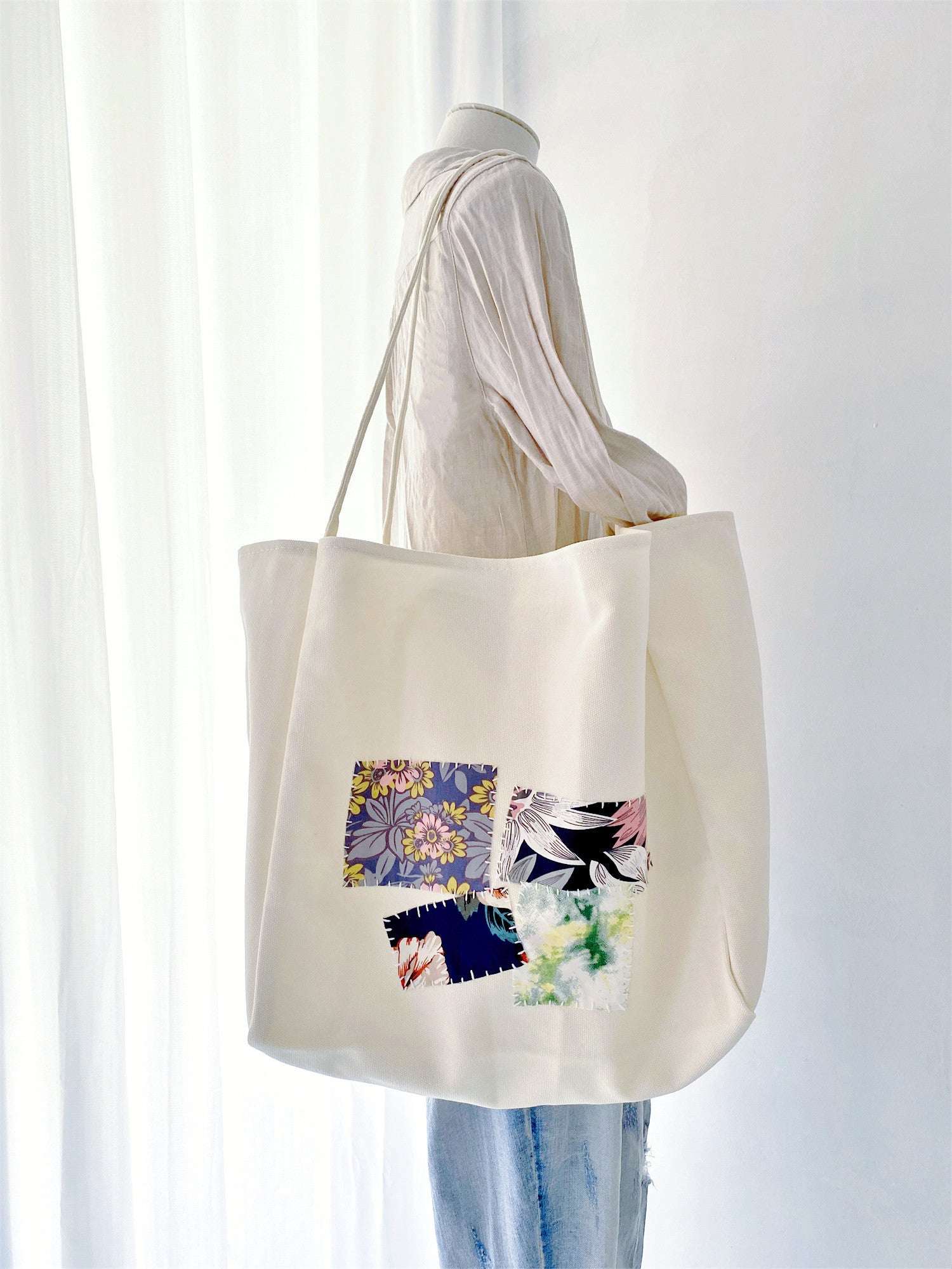 Celebrate sustainability with this unique, hand-stitched patchwork canvas tote, ideal for gifting to someone who appreciates both style and environmental care.