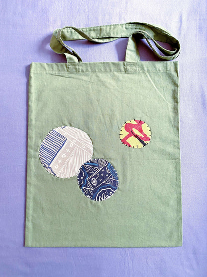 Ultra-soft olive cotton tote with hand-stitched details, feels like a warm hug on a busy day.