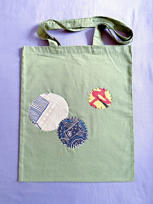 Ultra-soft olive cotton tote with hand-stitched details, feels like a warm hug on a busy day.