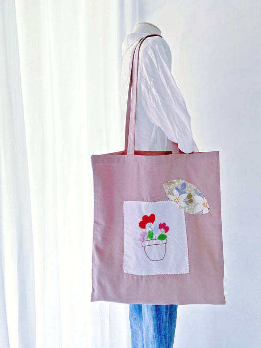A floral-embroidered cotton tote, lightweight and spacious, made for those who embrace an eco-conscious lifestyle.