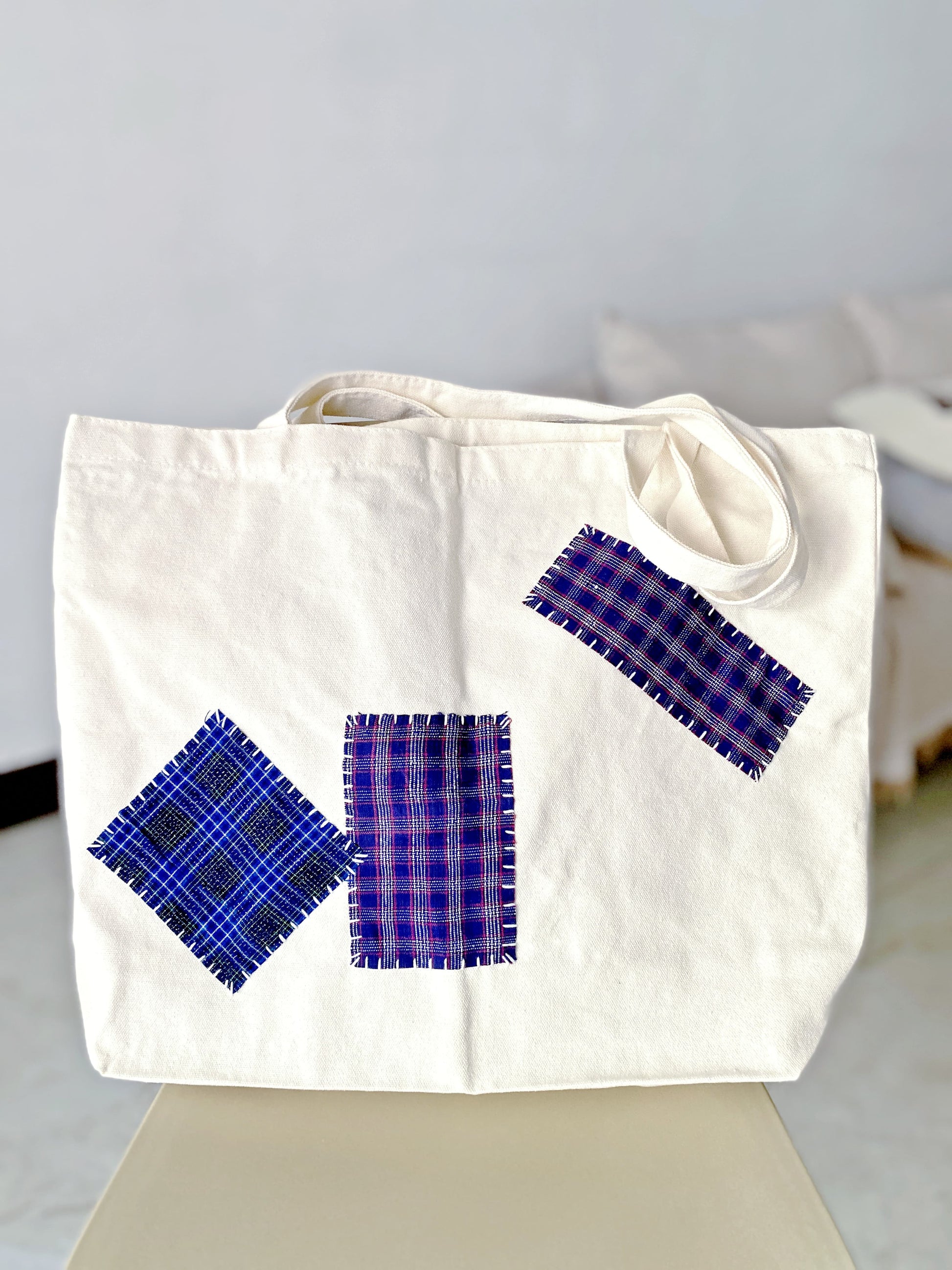 soft bag on a bench with a city street in the background