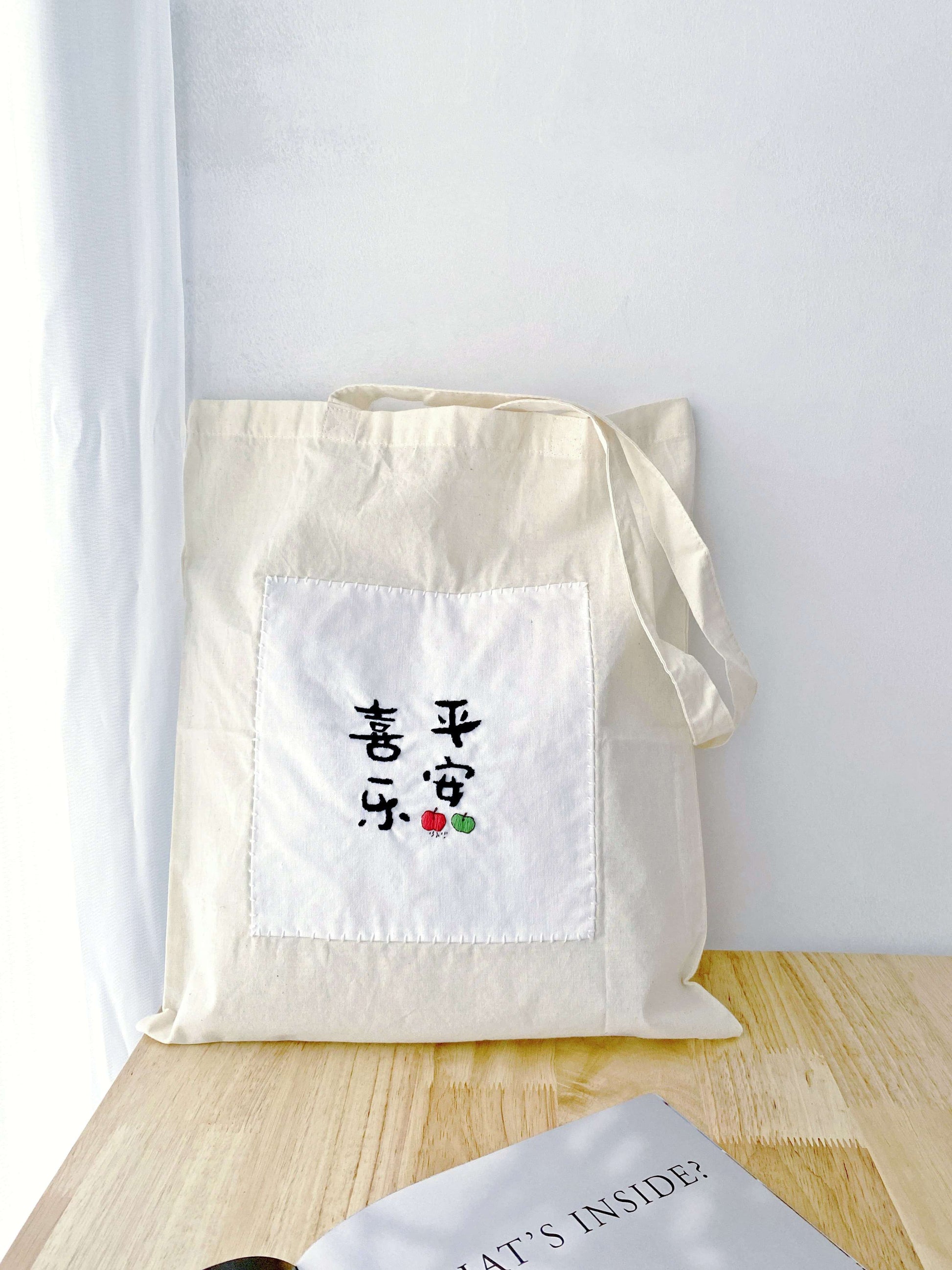 Essentials for slow living packed in a roomy soft tote, accented with a Zen-inspired hand-embroidered Chinese font.