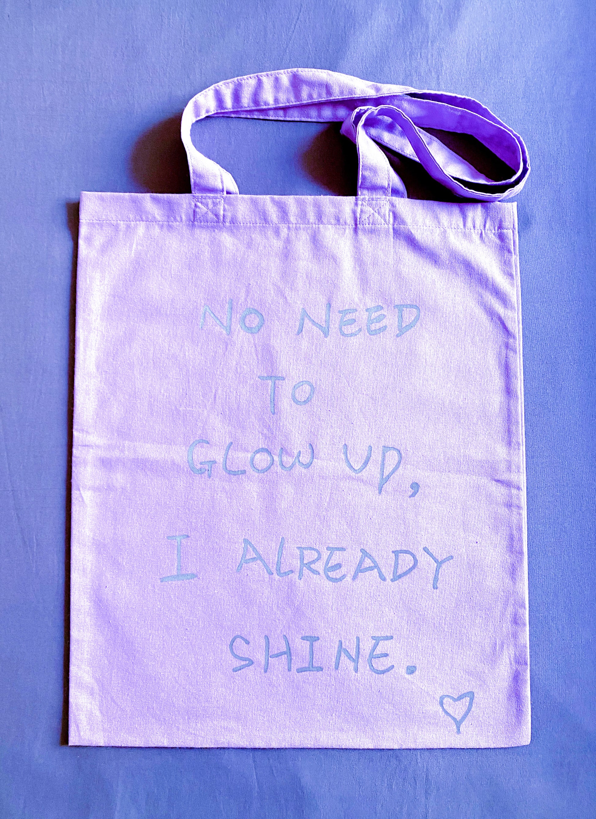 Ultra-soft purple cotton tote texture detail, feels weightless against skin for all-day comfort.