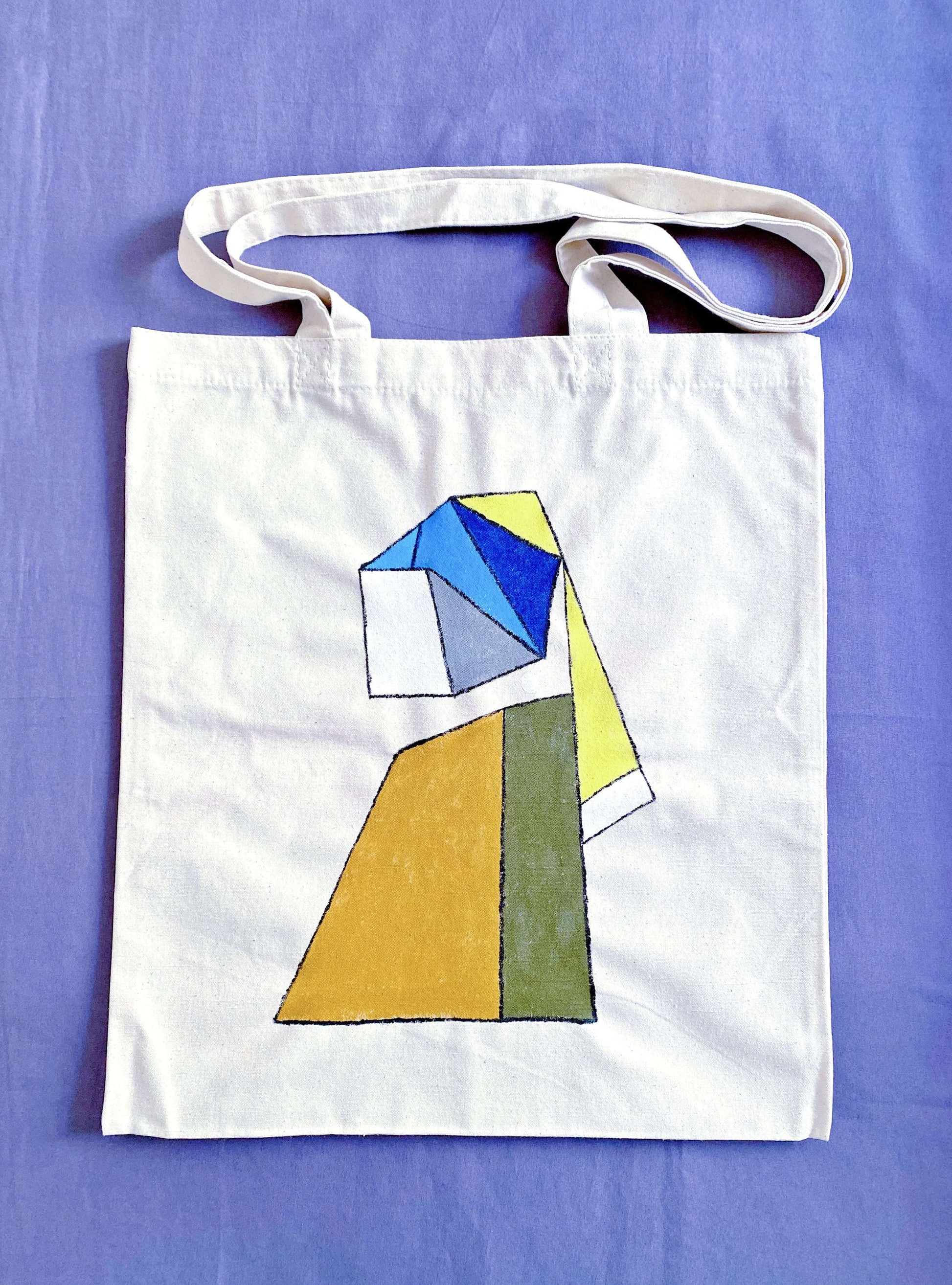 Bohemian aesthetic tote draped on a chair, showing the unique texture of non-synthetic natural fiber.