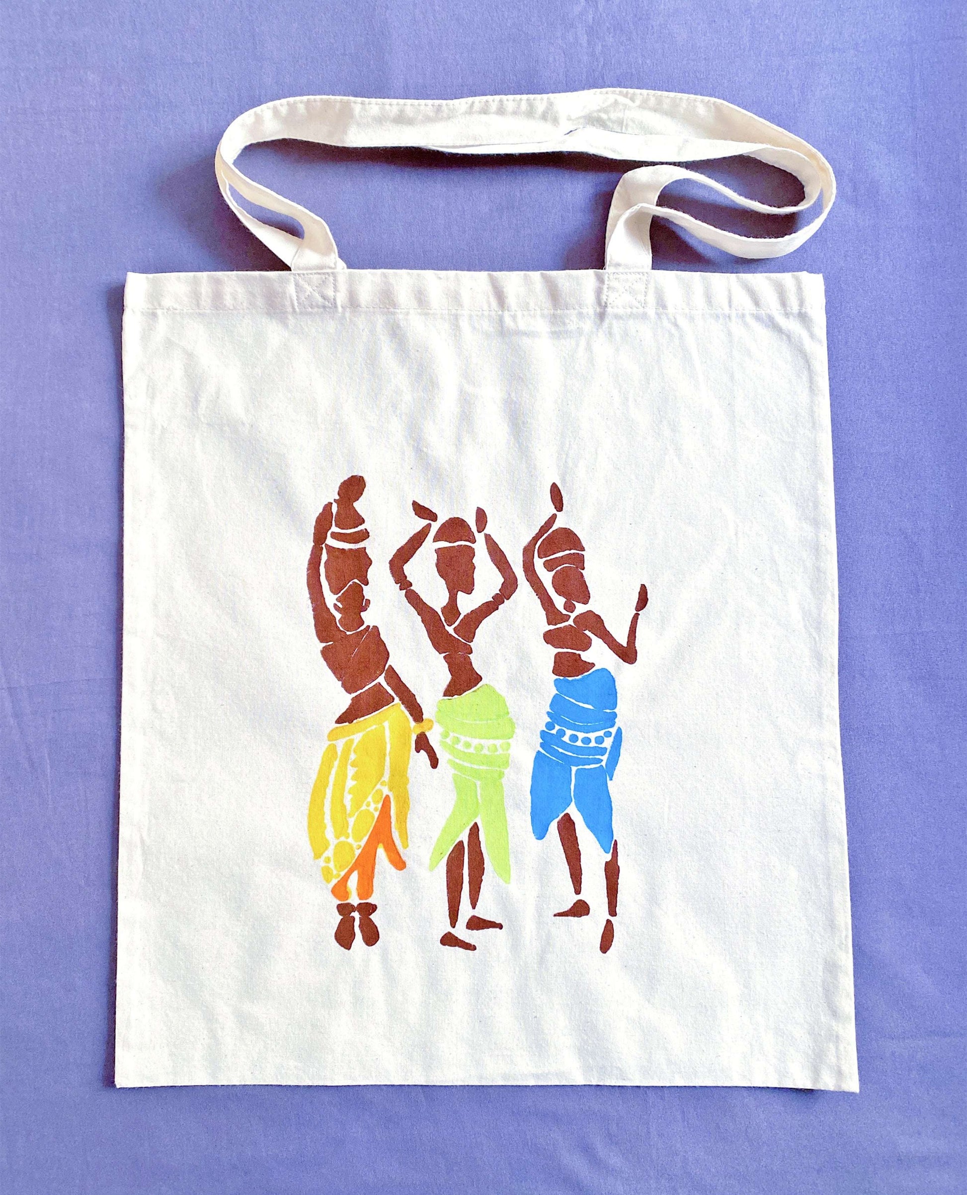 Hand-printed Egyptian pattern tote bag resting on a park bench, capturing a quiet moment of slow living in a busy city.