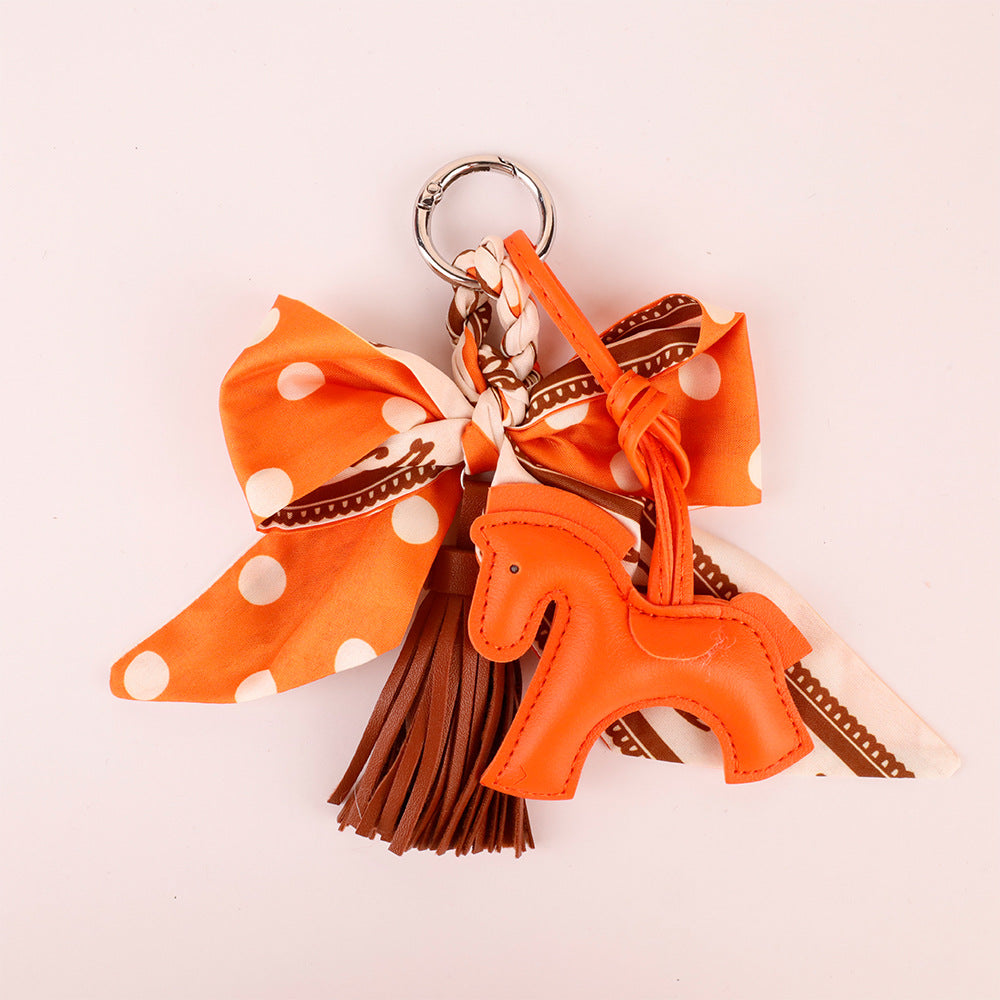 Handmade orange bag accessory for totes and backpacks
