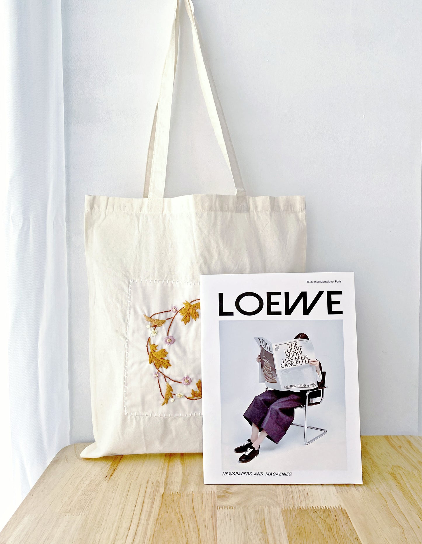 Stylish cotton tote appealing to those who love literary and handmade-look accessories.