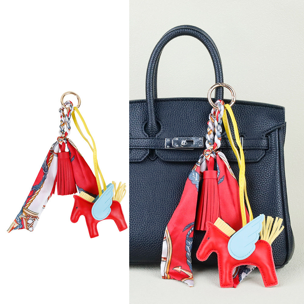Versatile horse tassel keychain styled on a commuter backpack for a personalized look