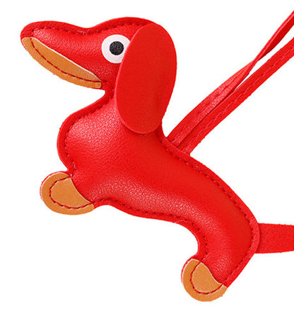 Cute leather dog bag charm presented in gift packaging
