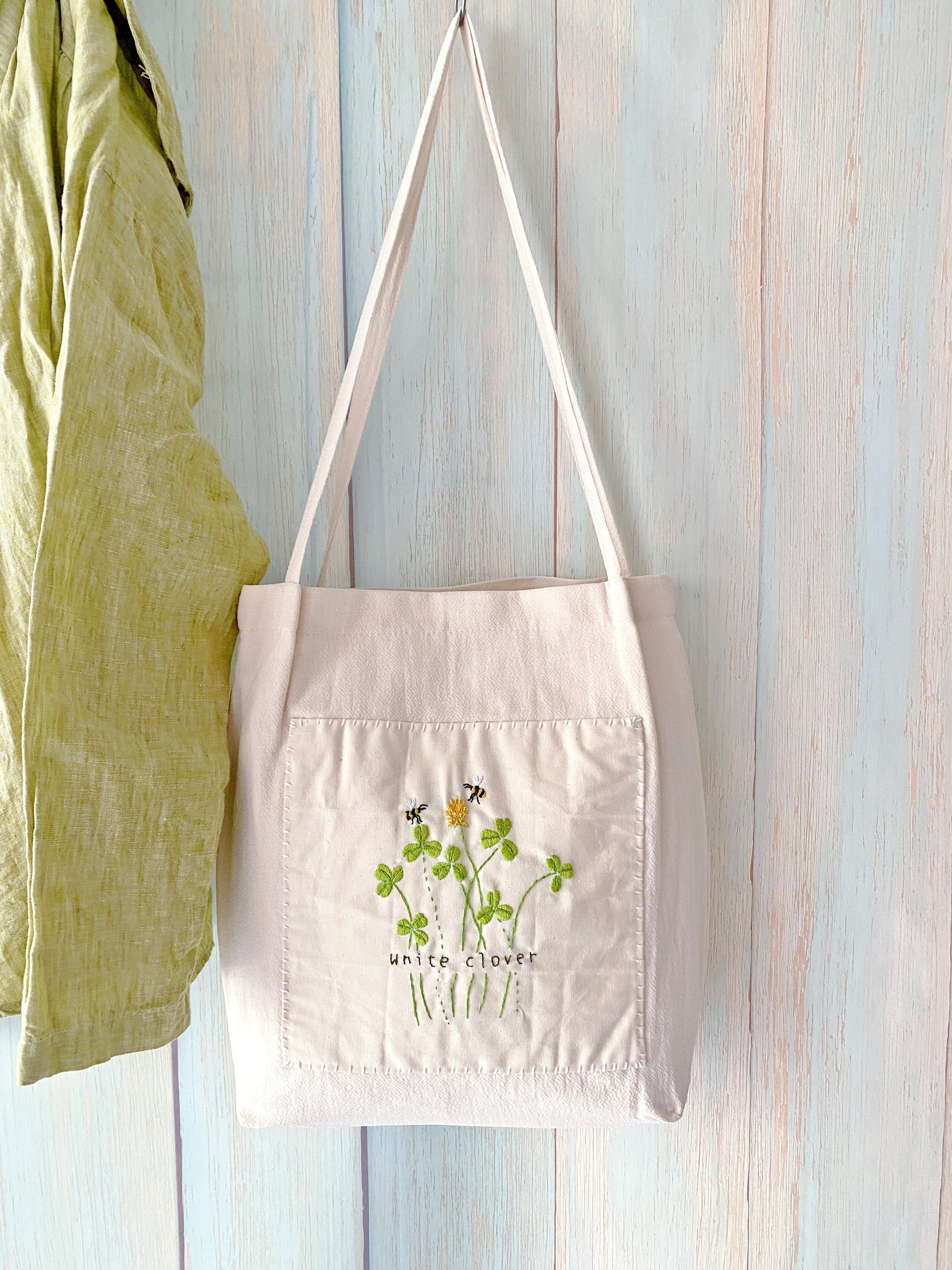 Minimalist floral embroidered cotton canvas shoulder bag for a gardening enthusiast mom on Mother's Day