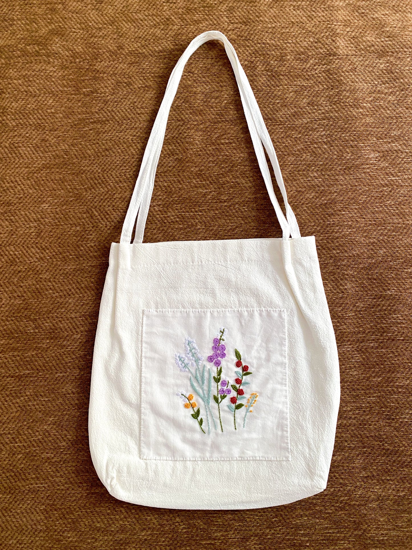 Handmade embroidered floral shoulder bag chosen for a friend who loves slow living style