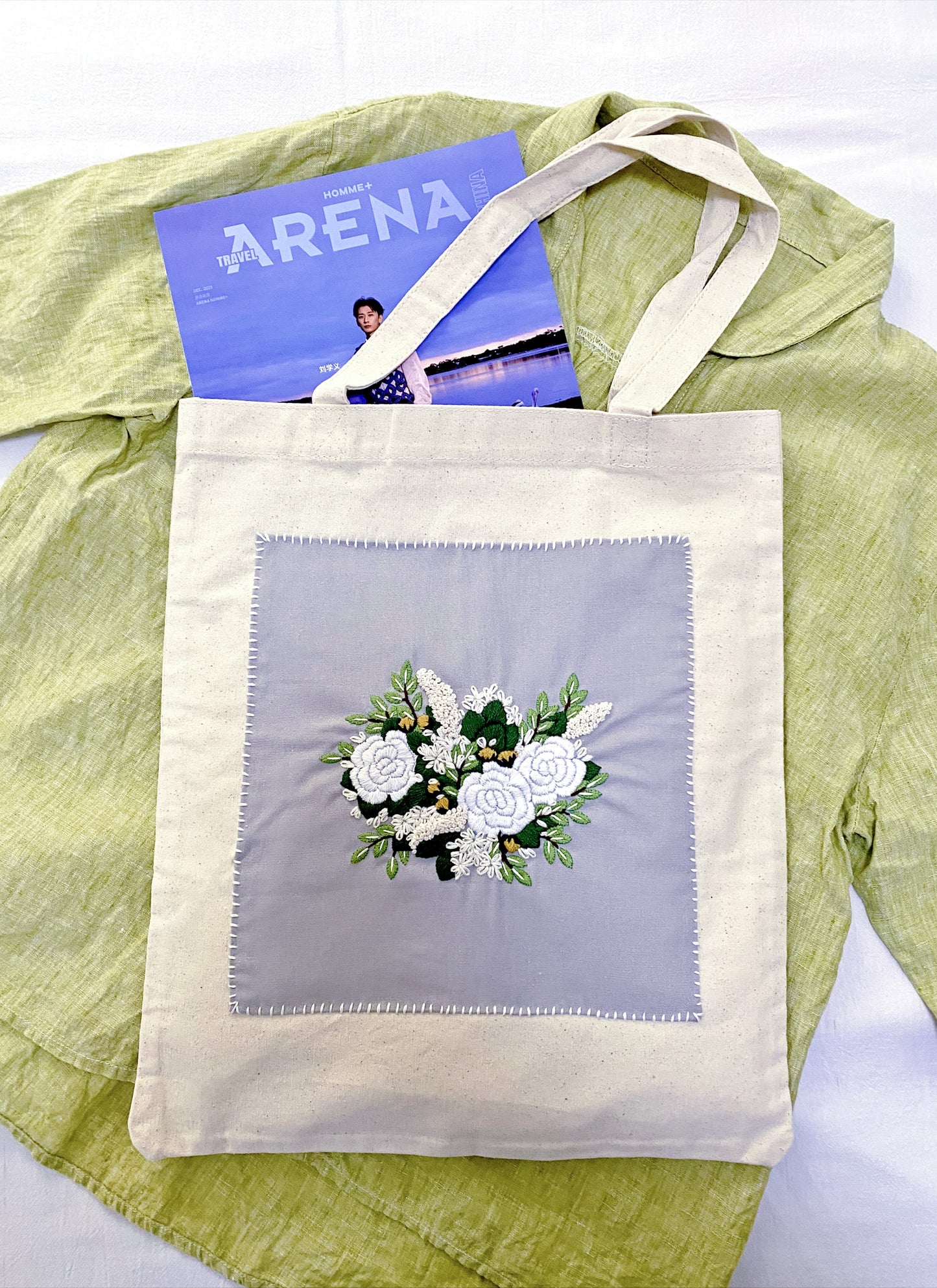 A spacious tote bag featuring an embroidered botanical motif for someone who values human touch over mass production.