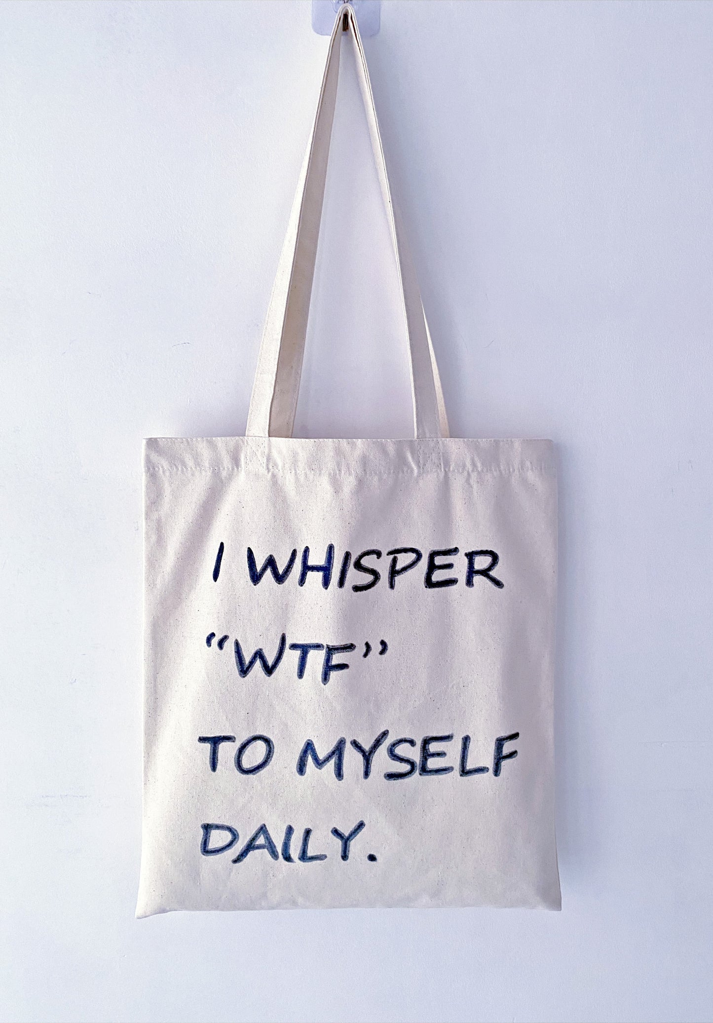 roomy canvas shoulder tote with artistic handwriting detail for weekend market trips