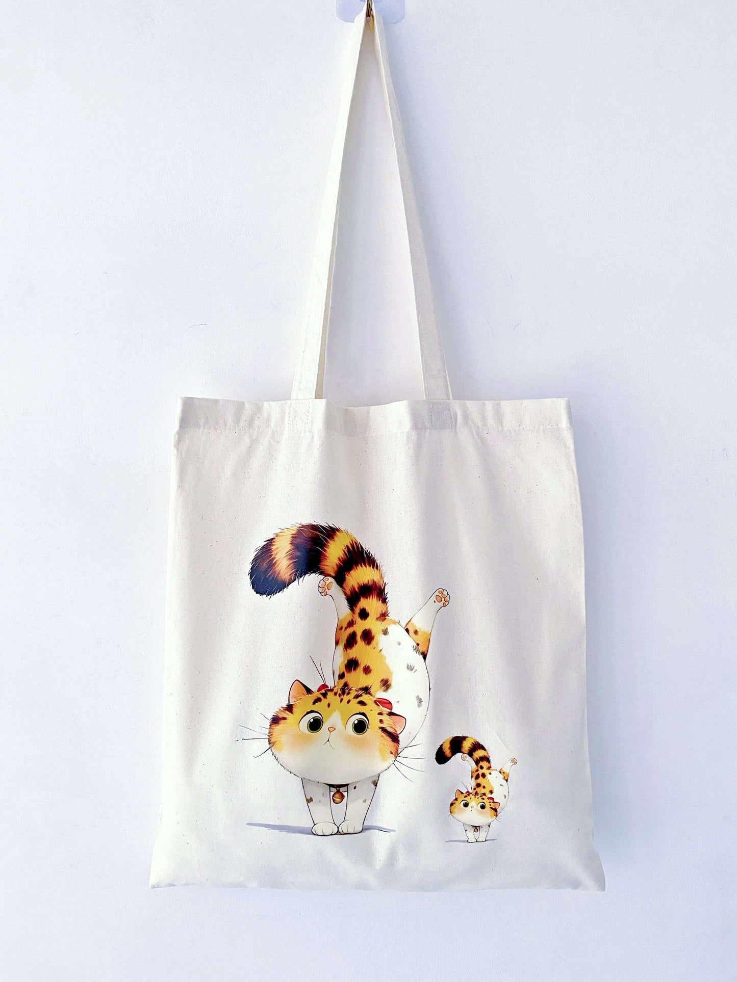 This orange cat-printed tote is the perfect gift for cat lovers and eco-conscious friends who love practical, stylish accessories.