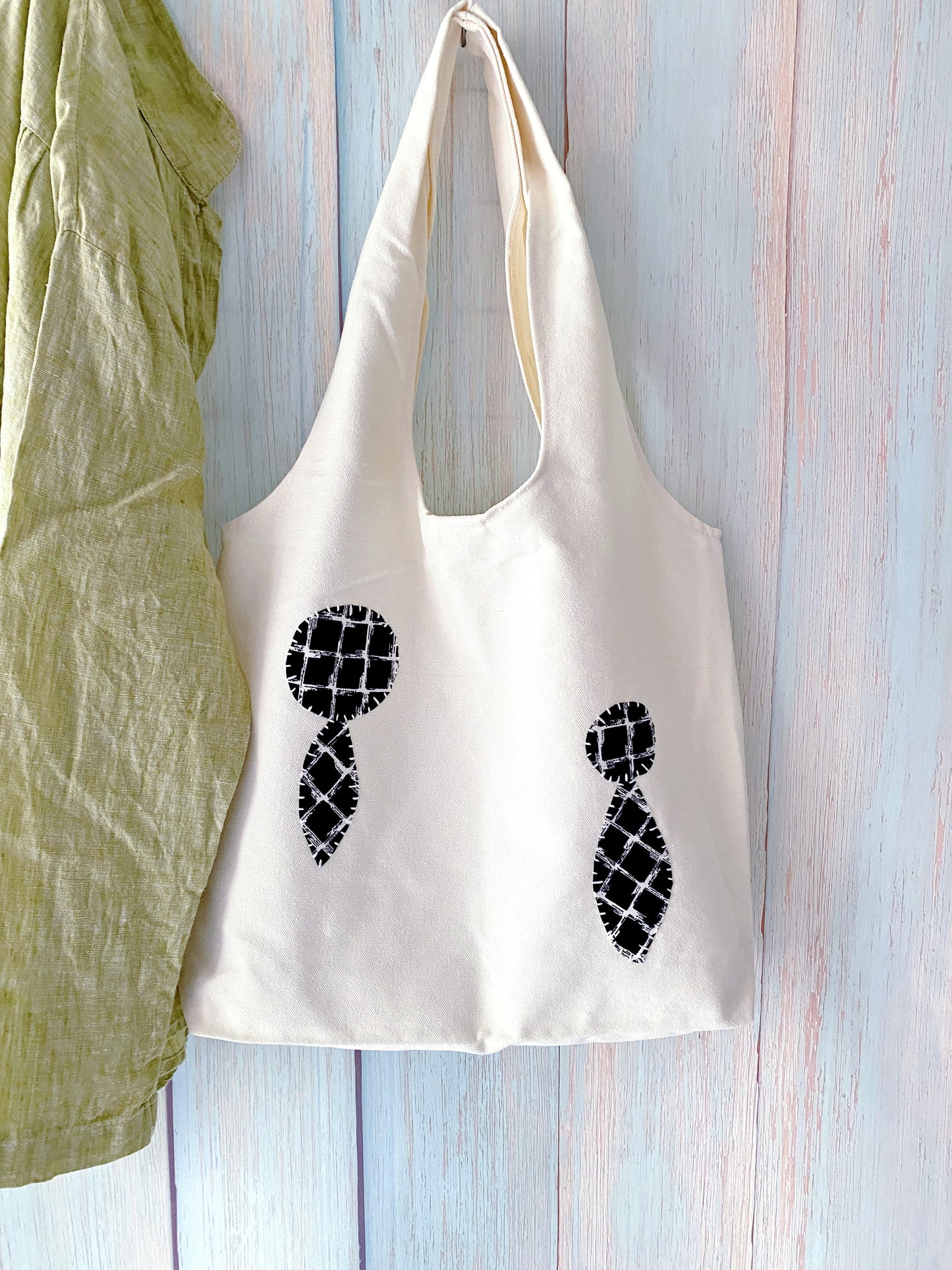 Lightweight canvas tote used for casual grocery run in a calm slow living lifestyle