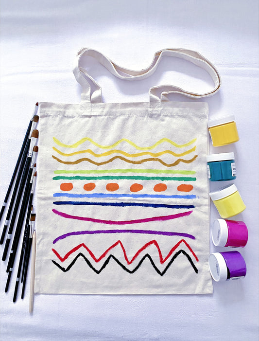 Hand-painted brushstrokes on a minimalist tote reflecting artisanal uniqueness.