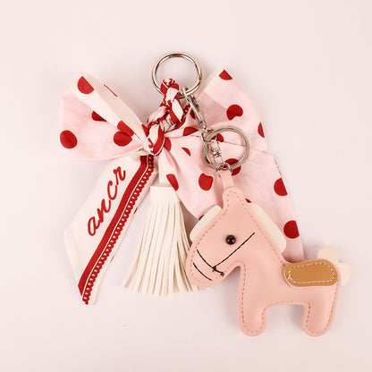 Polka dot scarf bow charm for a handbag handle