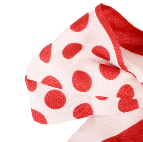 Decorative red scarf-style bag charm with a tied bow