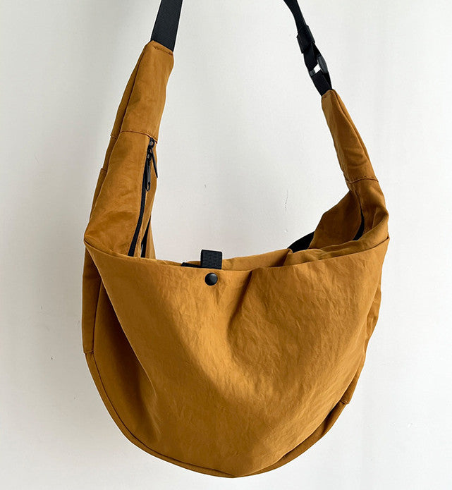 Soft nylon crescent tote bag for subway transit and daily commute