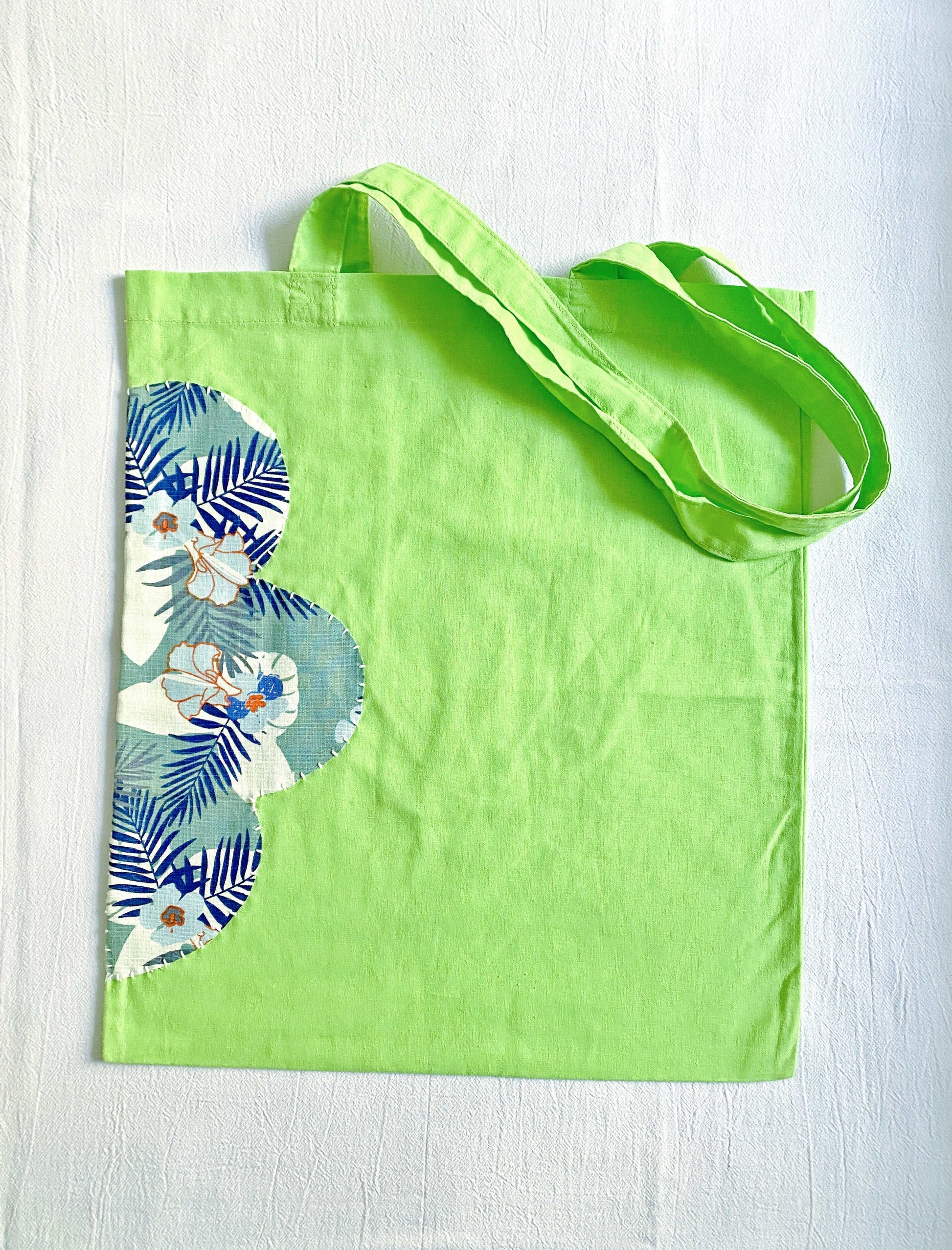 A versatile, sustainable cotton tote with hand-sewn patchwork, making it a beautiful gift for friends or a stylish addition to your own collection.