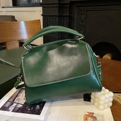 Fashion-forward leather handbag in classic design for women