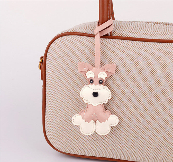 Little puppy charm displayed with car keys
