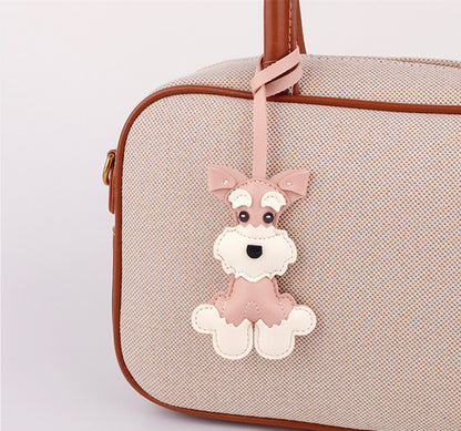Little puppy charm displayed with car keys