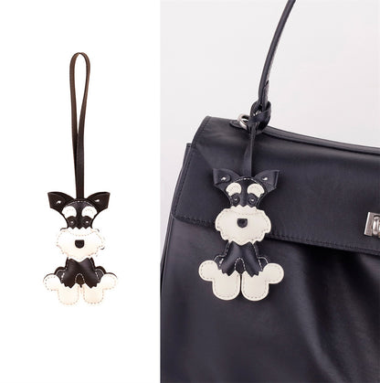 Compact dog keychain paired with an everyday bag